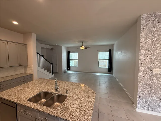 a kitchen with a sink and faucet