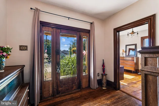 a view of a wooden fence under a large tree