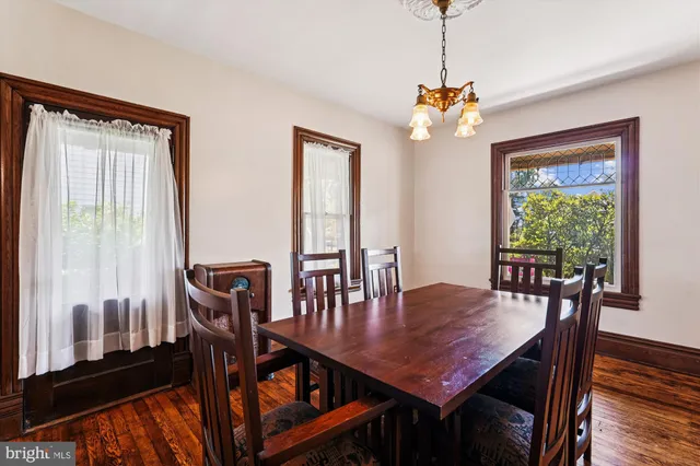 a kitchen with stainless steel appliances granite countertop wooden cabinets a refrigerator and a sink