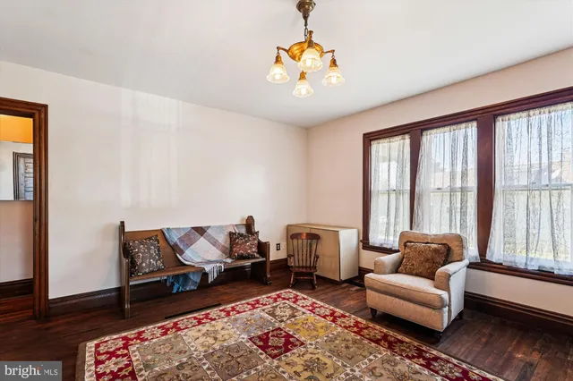 a bedroom with bed and glass door