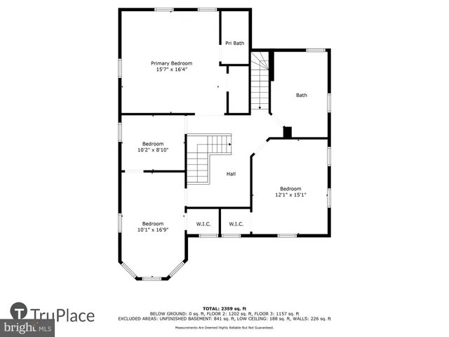 a backyard of a house with a yard and large trees