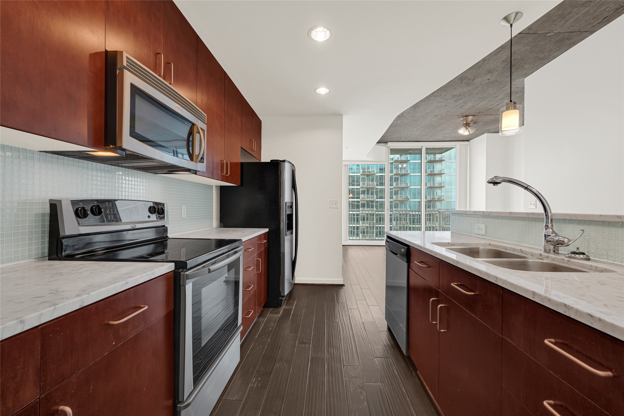 5925 Almeda Road, Unit 12308 Houston, TX 77004 - Photo 1 of 48 a kitchen with stainless steel appliances granite countertop a sink stove and refrigerator