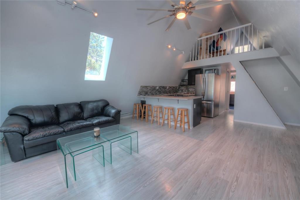 217 G Road Silverthorne, CO 80498 - Photo 2 of 24 a living room with furniture and a chandelier