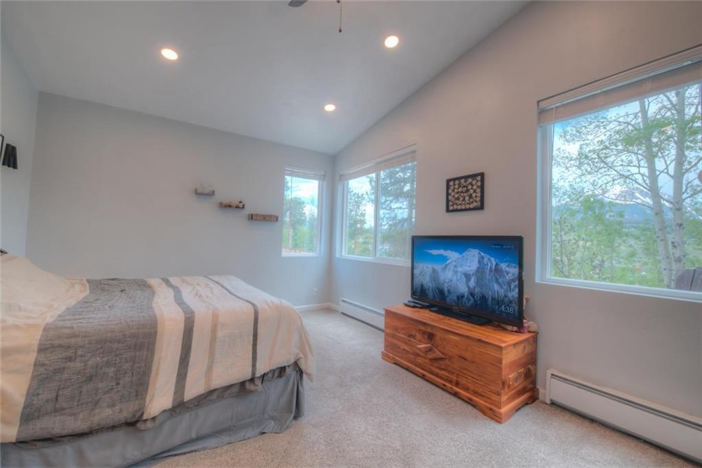 217 G Road Silverthorne, CO 80498 - Photo 11 of 24 a bedroom with a bed and a night stand