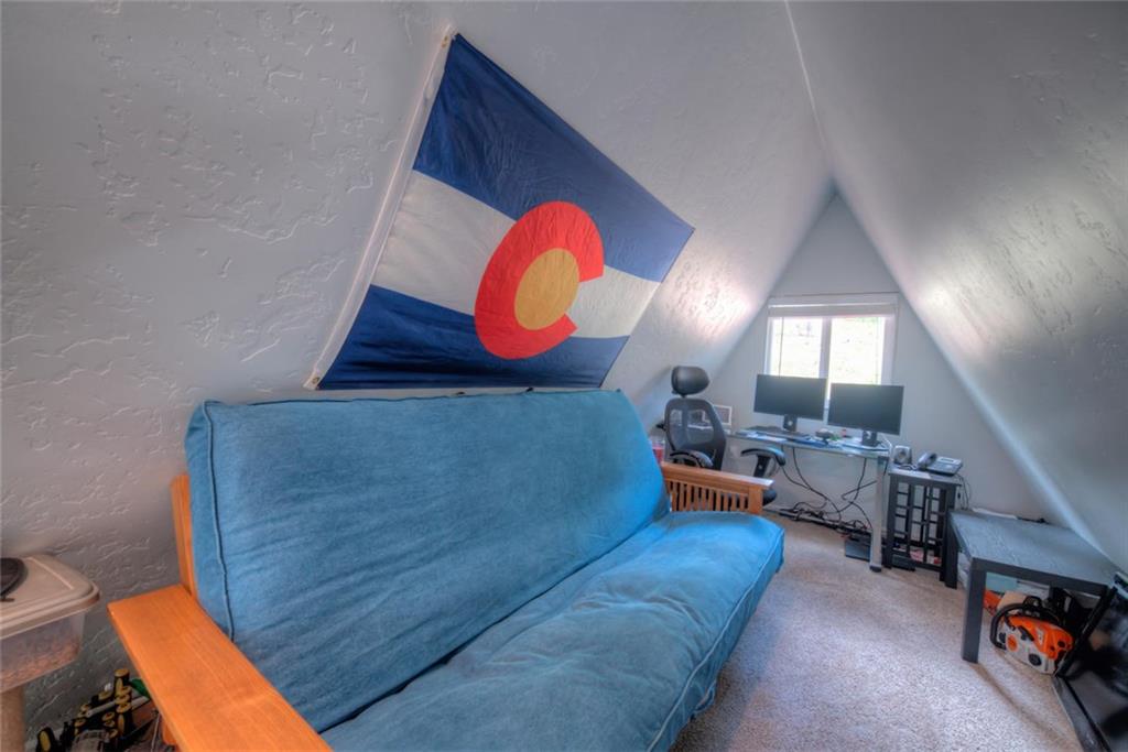 217 G Road Silverthorne, CO 80498 - Photo 15 of 24 a living room with furniture and a fireplace