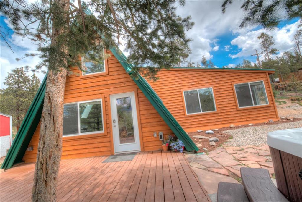 217 G Road Silverthorne, CO 80498 - Photo 16 of 24 a view of a house with wooden deck and a large tree