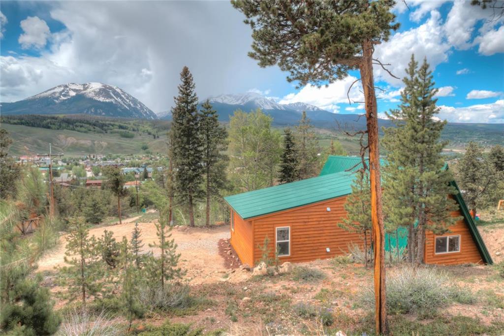 217 G Road Silverthorne, CO 80498 - Photo 17 of 24 a view of a brick house with a yard
