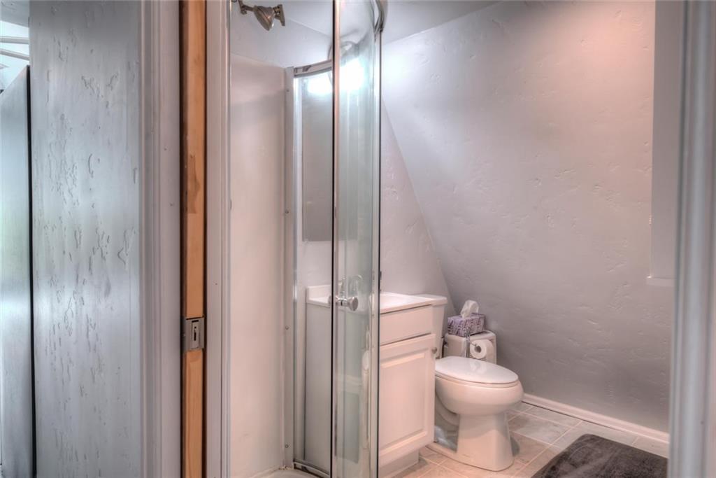 217 G Road Silverthorne, CO 80498 - Photo 8 of 24 a white toilet sitting next to a bathroom sink