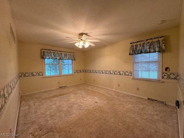 2036 Salt Springs Road Warren, OH 44481 - Photo 17 of 23 Spare room featuring ceiling fan and carpet