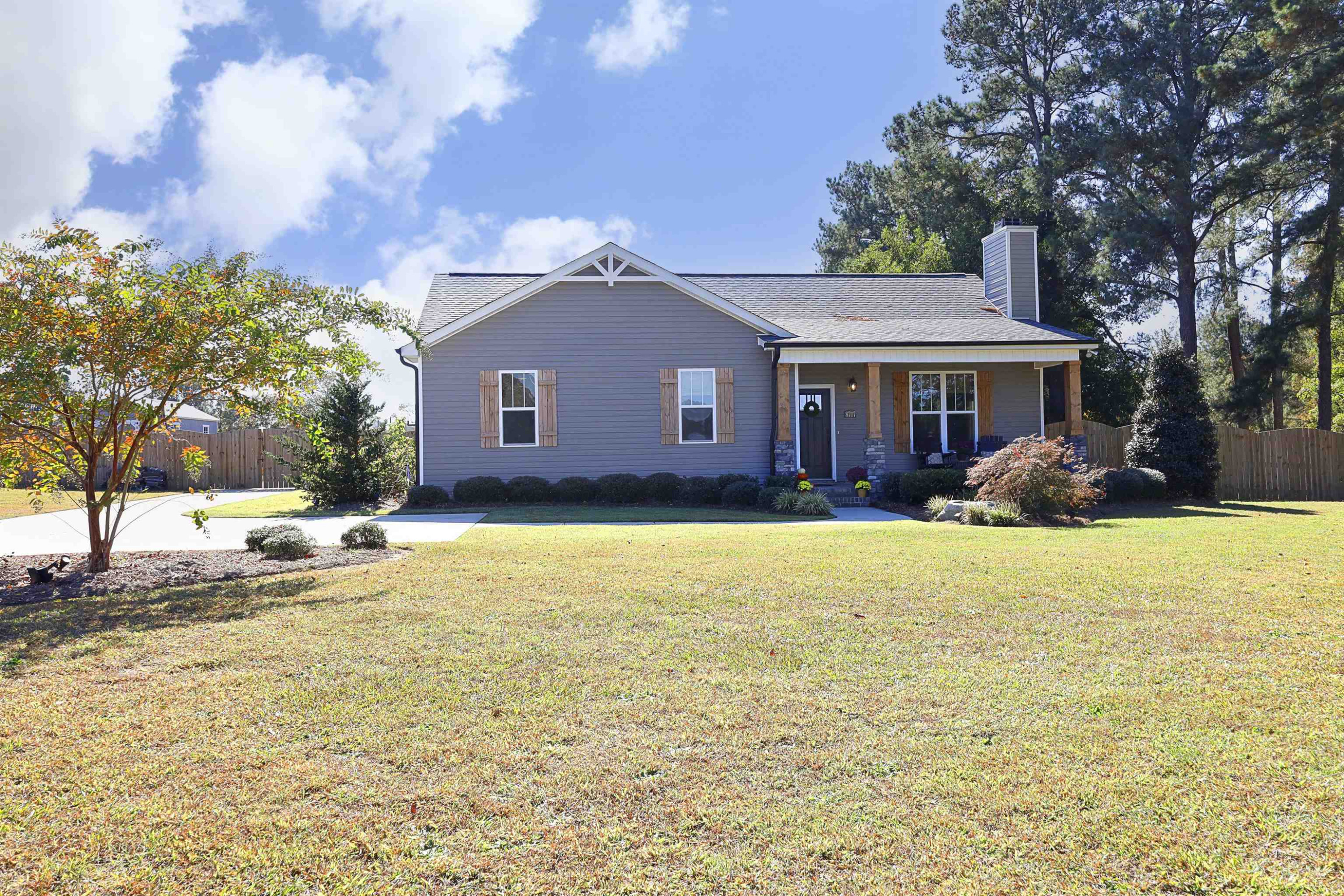 8717 Mt Pleasant Church Road Willow Spring, NC 27592 - Photo 1 of 2 a front view of house with yard and trees in the background