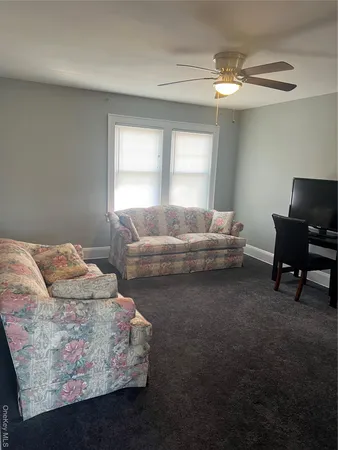 a view of a hallway with wooden floor and a hallway
