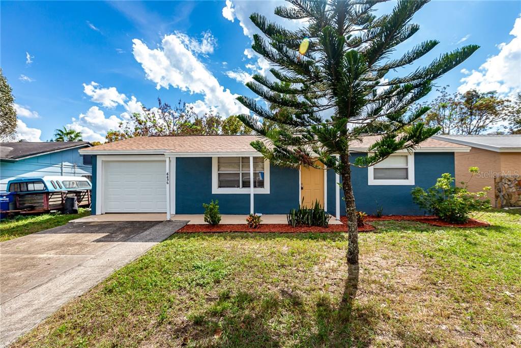 6436 Reno Avenue New Port Richey, FL 34653 - Photo 1 of 1 a house view with a sitting space and garden