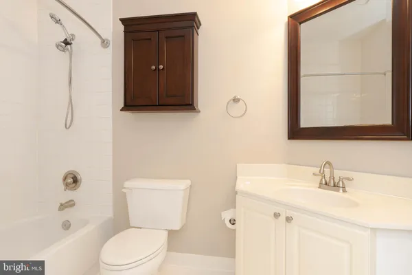 a bathroom with a bath tub with a shower