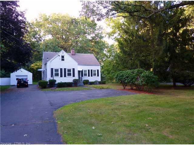 140 Sackett Point Road North Haven, CT 06473 - Photo 1 of 1 a front view of a house with garden