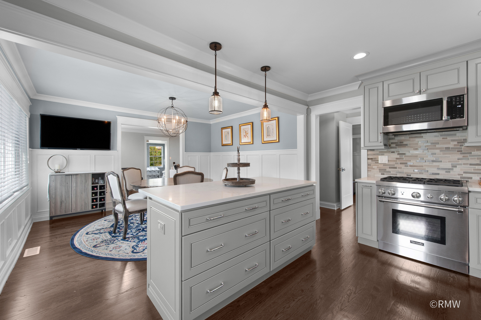 430 North Maple Street Itasca, IL 60143 - Photo 13 of 43 a kitchen with stainless steel appliances granite countertop a stove a sink and a microwave