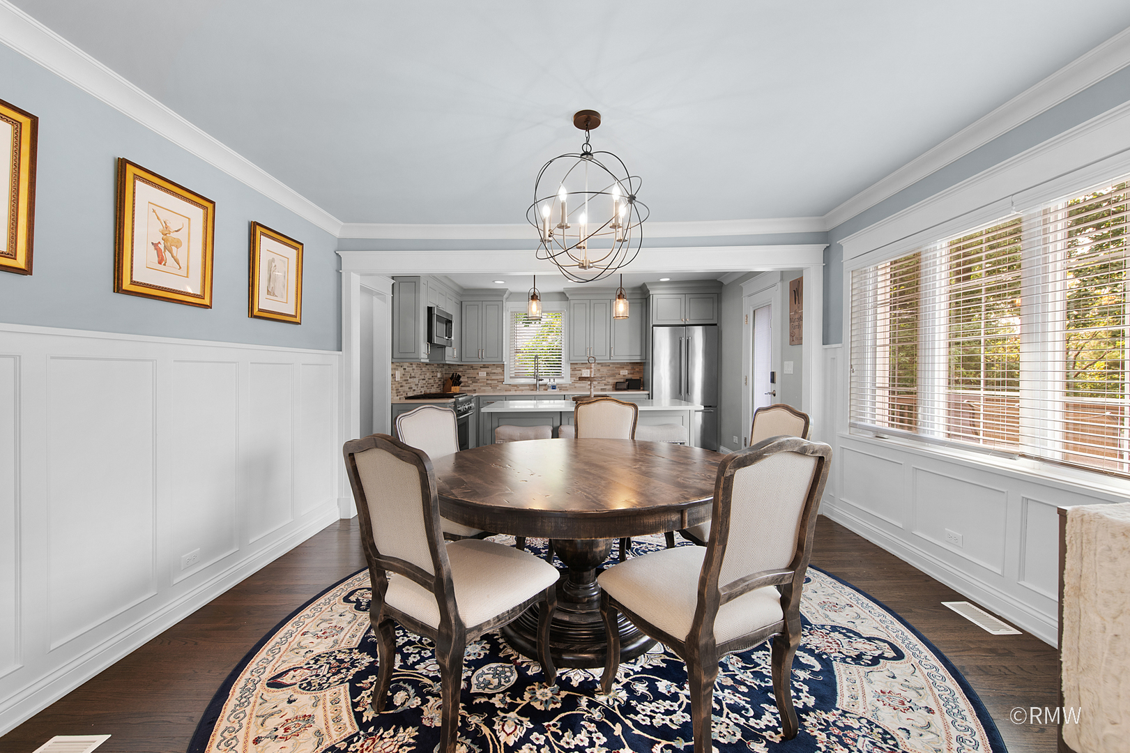 430 North Maple Street Itasca, IL 60143 - Photo 16 of 43 a view of a dining room with furniture a chandelier and wooden floor
