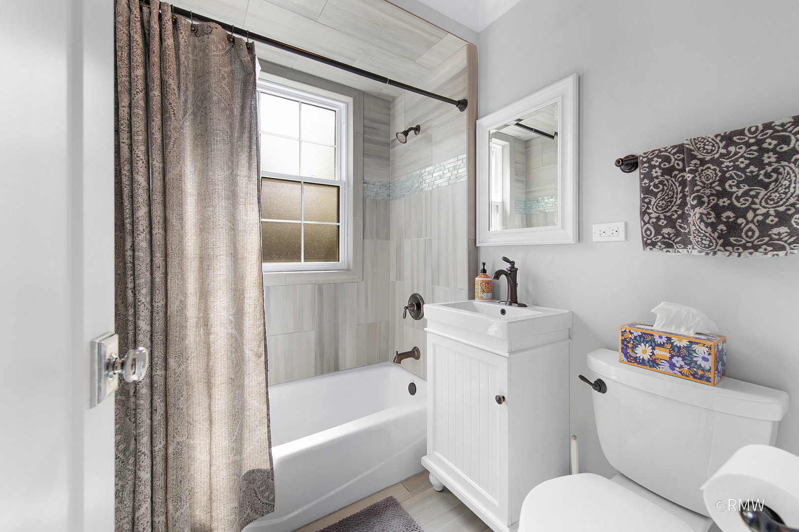 430 North Maple Street Itasca, IL 60143 - Photo 20 of 43 a white bath tub sitting next to a white toilet and a sink