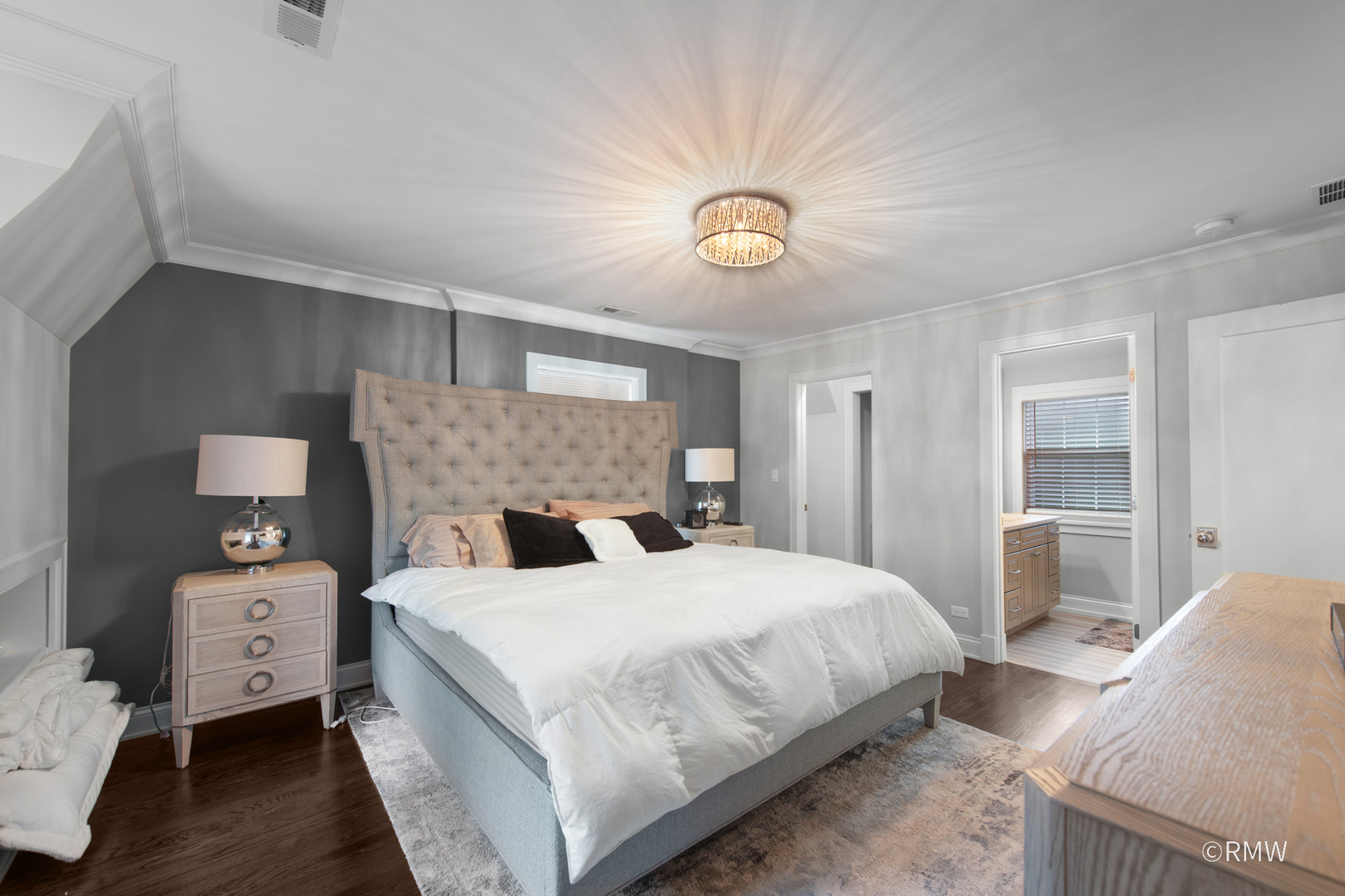 430 North Maple Street Itasca, IL 60143 - Photo 22 of 43 a bedroom with a bed and a chandelier