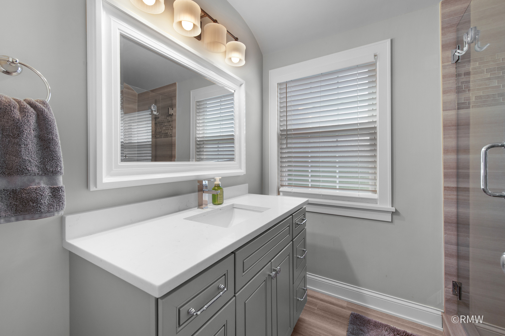 430 North Maple Street Itasca, IL 60143 - Photo 24 of 43 a bathroom with a sink and a window
