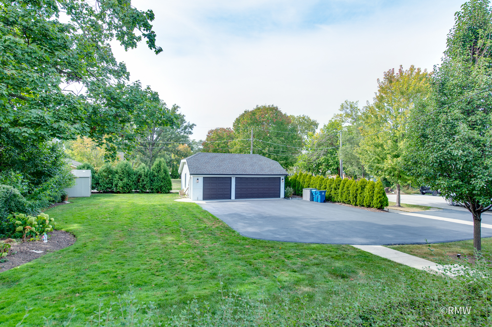 430 North Maple Street Itasca, IL 60143 - Photo 35 of 43 a wooden bench sitting in middle of the middle of a field