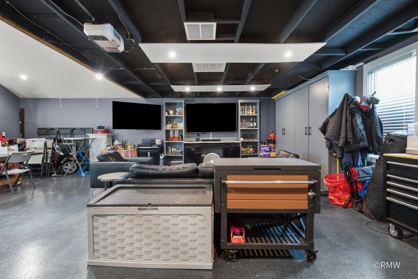 430 North Maple Street Itasca, IL 60143 - Photo 43 of 43 a living room with furniture a flat screen tv and a table