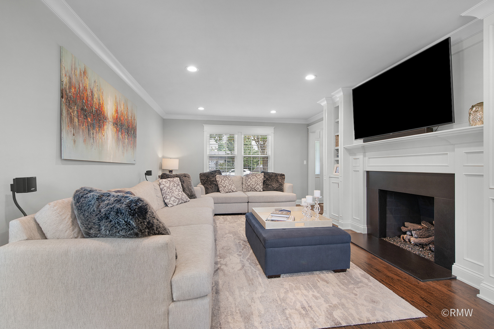 430 North Maple Street Itasca, IL 60143 - Photo 6 of 43 a living room with furniture a flat screen tv and a fireplace