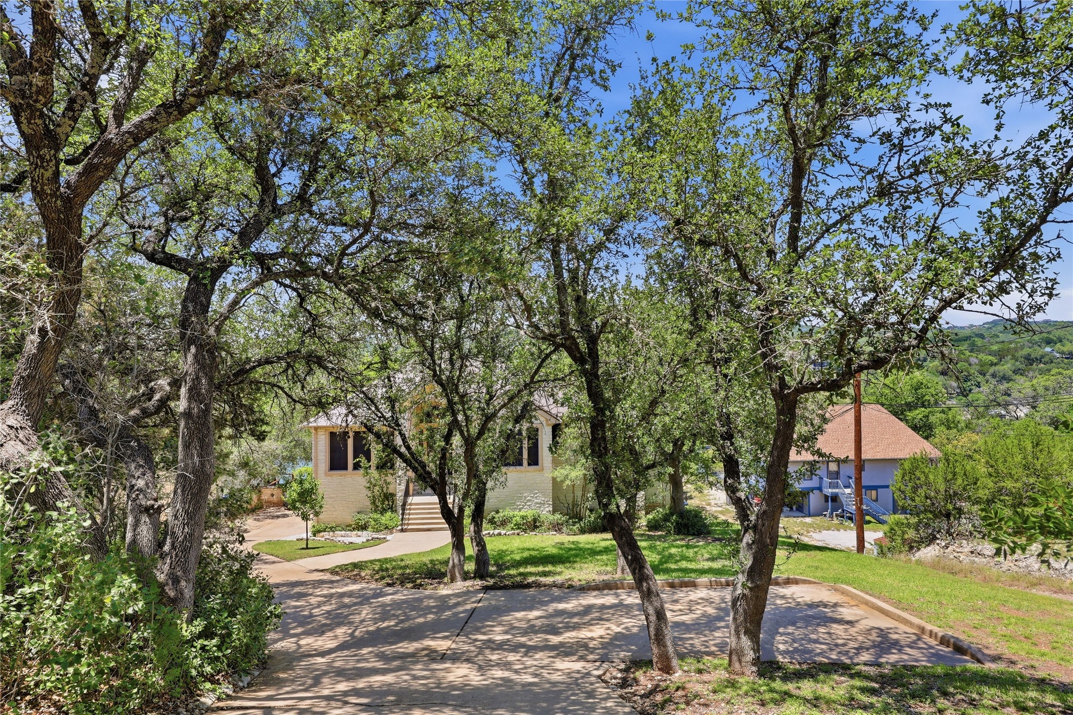 10802 Beach Road Leander, TX 78641 - Photo 37 of 40 View of the home as you approach from the road. Very private and stately!