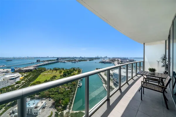 a view of a balcony with furniture