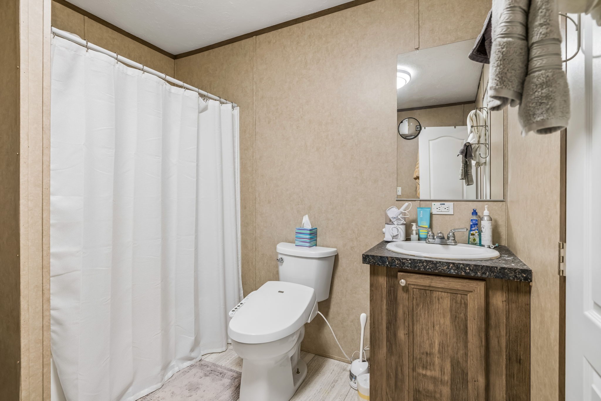 280 Kingdom Road Unionville, TN 37180 - Photo 16 of 65 a bathroom with a granite countertop sink a toilet and a mirror