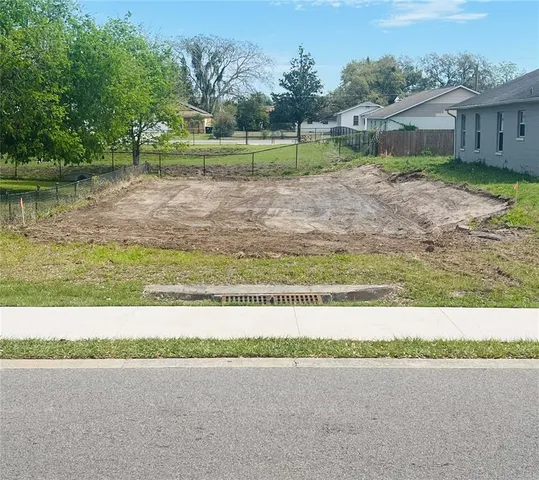 a view of a yard with a trampoline
