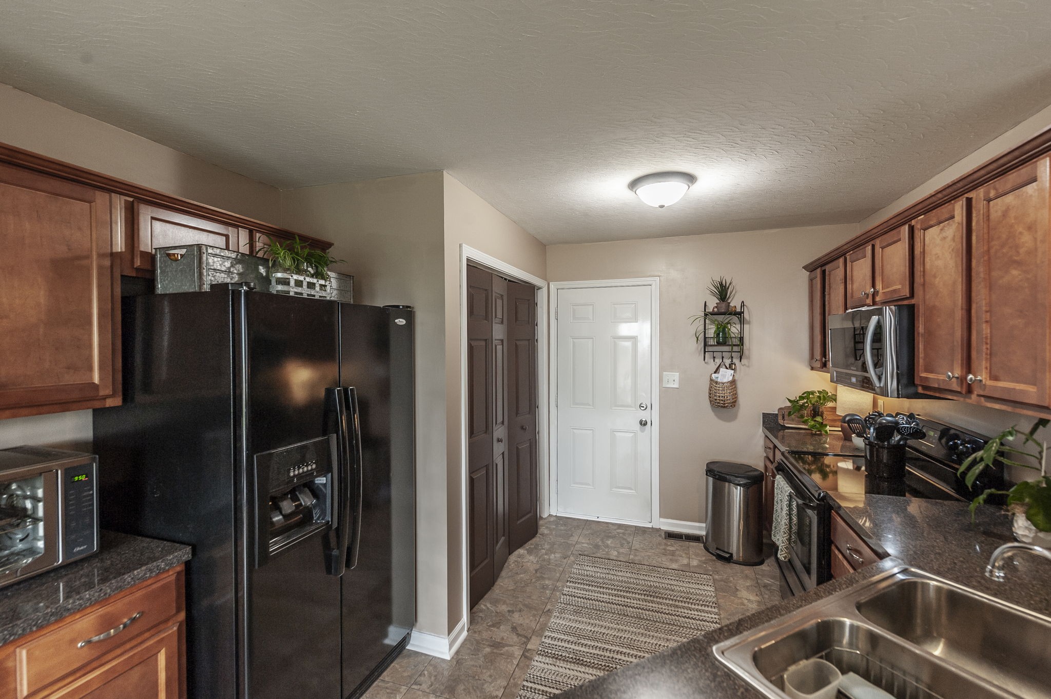 1183 Bothwell Place Gallatin, TN 37066 - Photo 17 of 53 a kitchen with stainless steel appliances granite countertop a refrigerator and a sink