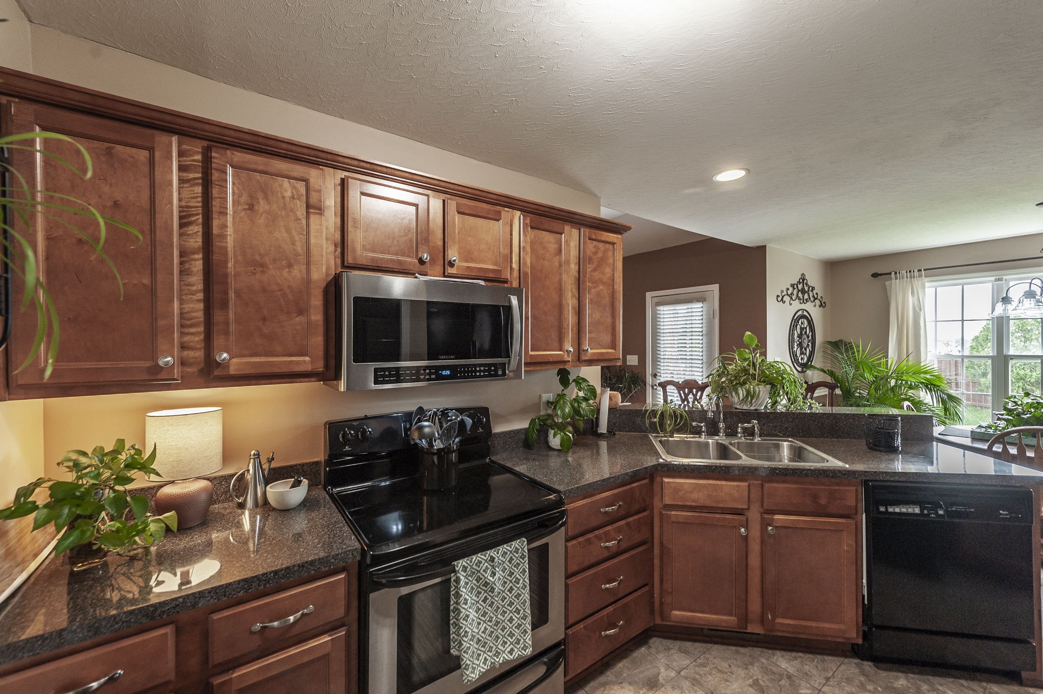 1183 Bothwell Place Gallatin, TN 37066 - Photo 18 of 53 a kitchen with granite countertop a sink and a stove top oven