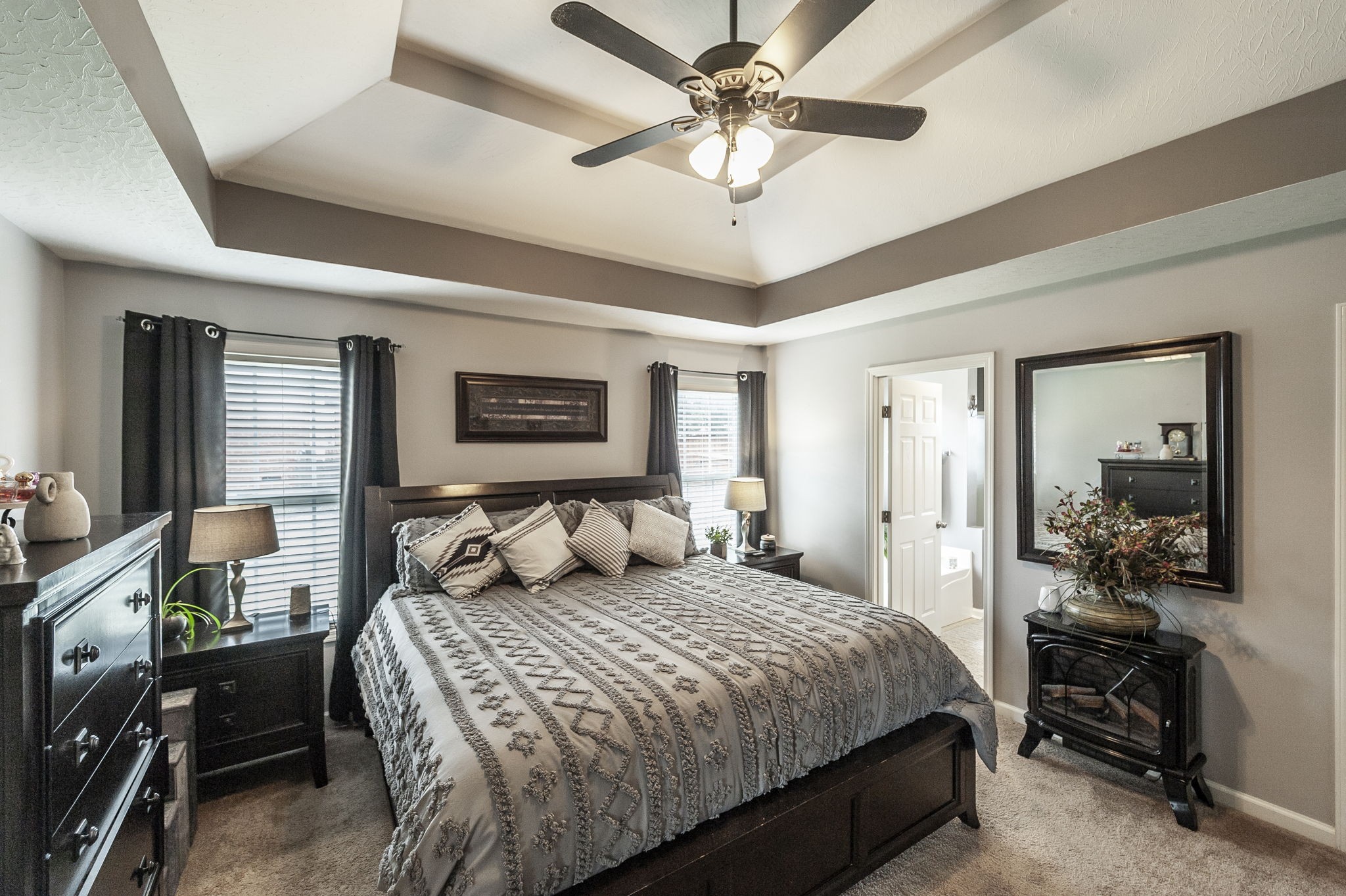 1183 Bothwell Place Gallatin, TN 37066 - Photo 27 of 53 a bedroom with a large bed and a chandelier