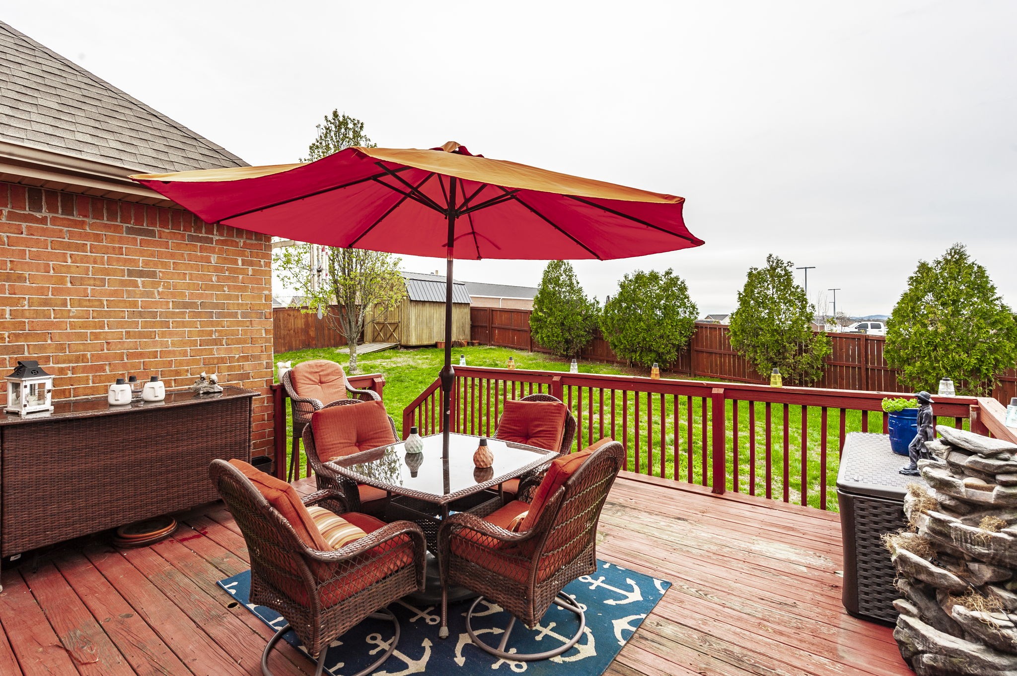 1183 Bothwell Place Gallatin, TN 37066 - Photo 42 of 53 an outdoor sitting area with furniture and wooden deck