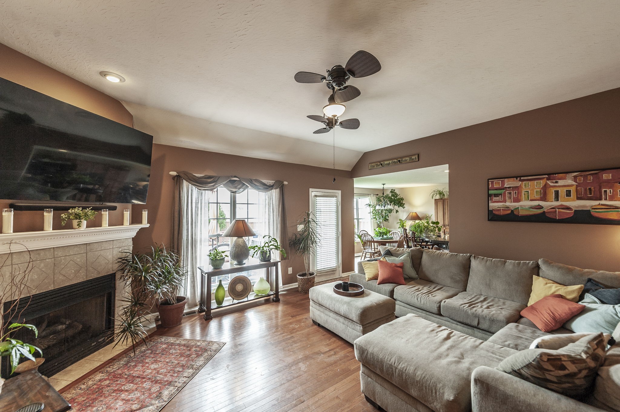 1183 Bothwell Place Gallatin, TN 37066 - Photo 6 of 53 a living room with furniture a fireplace and a flat screen tv