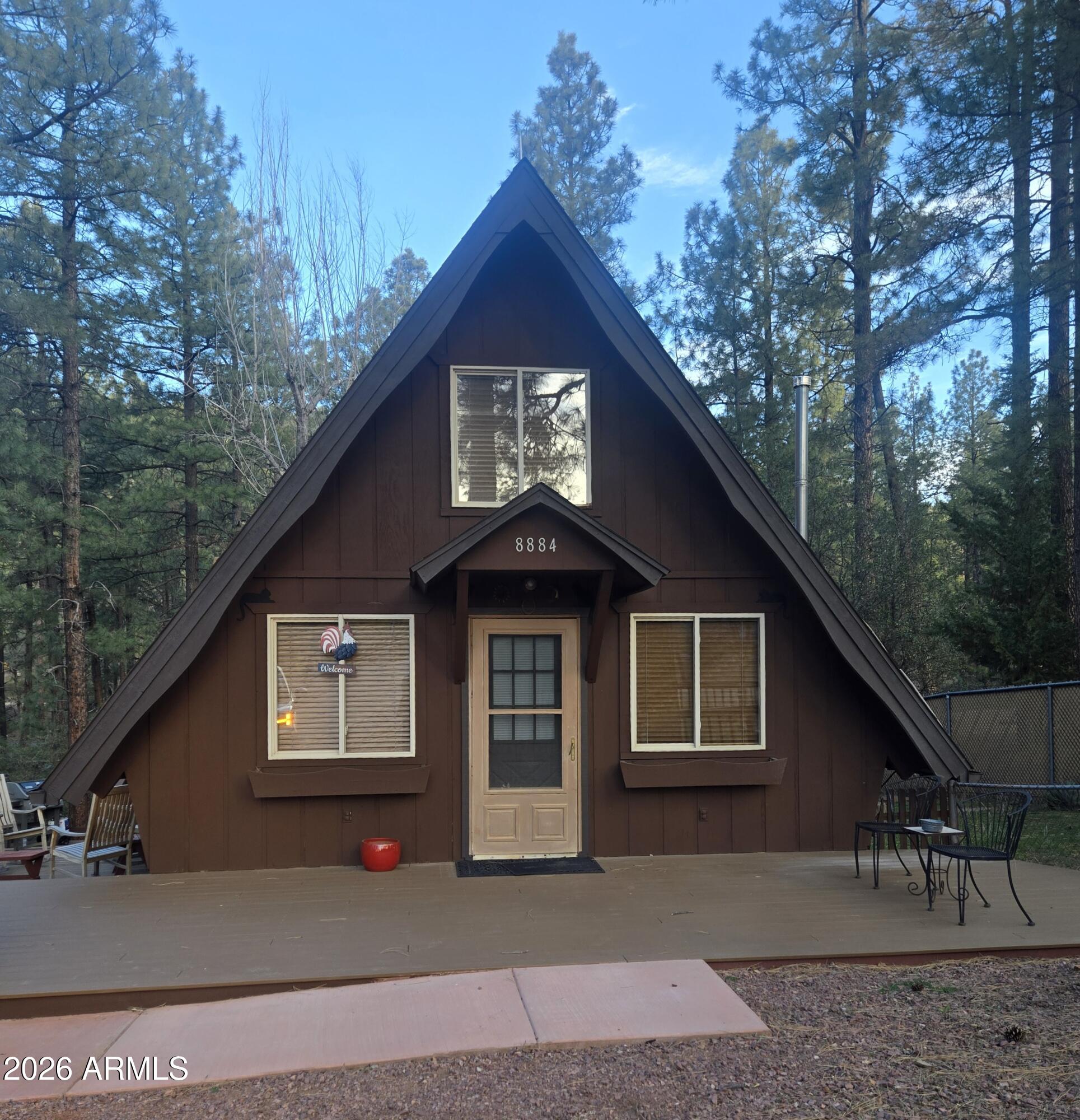 8884 Tonto Rim Drive Pine, AZ 85544 - Photo 3 of 43 a front view of a house with a garden