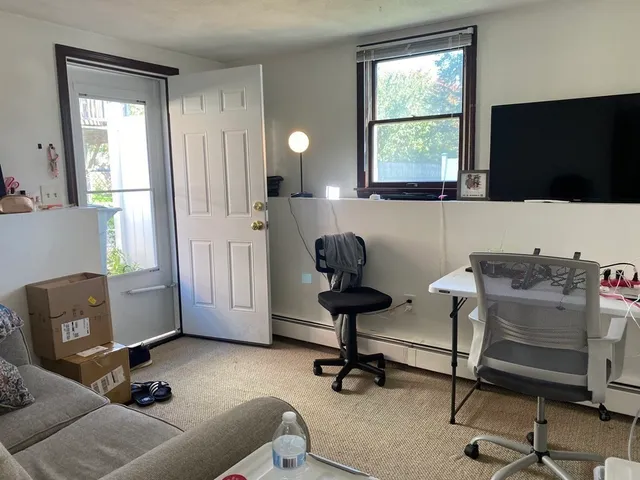 a workspace with furniture and a window