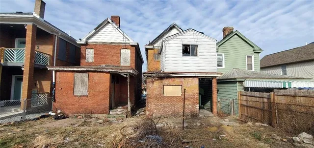 a view of a house with large windows