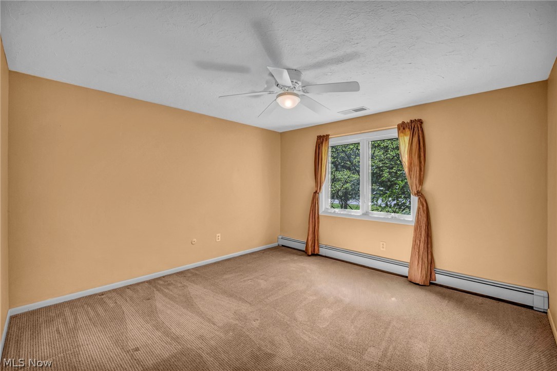 6845 Liberty Road Solon, OH 44139 - Photo 30 of 47 Spacious room featuring neutral carpeting, a dual-pane window, and a ceiling fan with integrated lighting