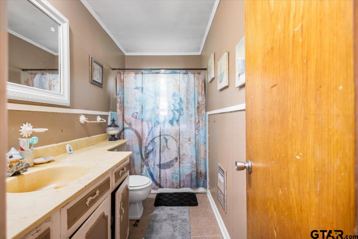 3211 Shady Trail Drive Tyler, TX 75702 - Photo 20 of 30 a bathroom with a sink toilet and shower