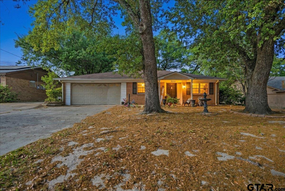 3211 Shady Trail Drive Tyler, TX 75702 - Photo 2 of 30 a view of a house with backyard and tree