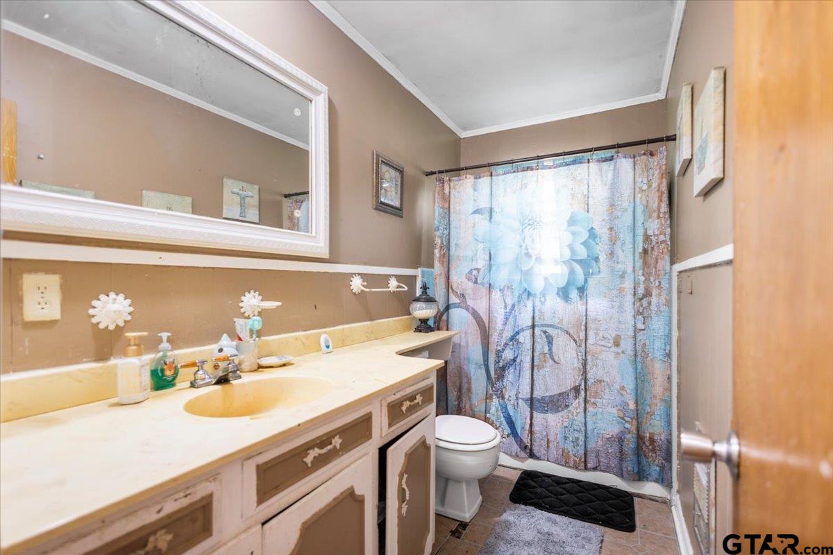 3211 Shady Trail Drive Tyler, TX 75702 - Photo 21 of 30 a bathroom with a sink toilet vanity and shower