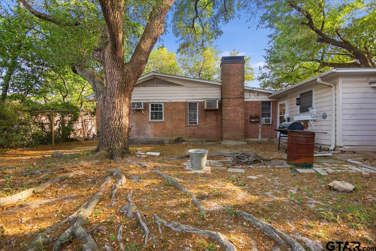 3211 Shady Trail Drive Tyler, TX 75702 - Photo 28 of 30 a backyard of a house with seating space