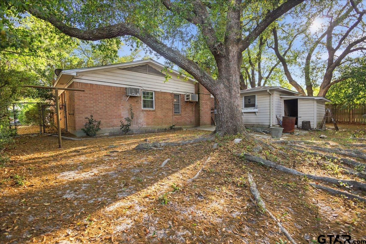 3211 Shady Trail Drive Tyler, TX 75702 - Photo 29 of 30 a view of a house with a yard