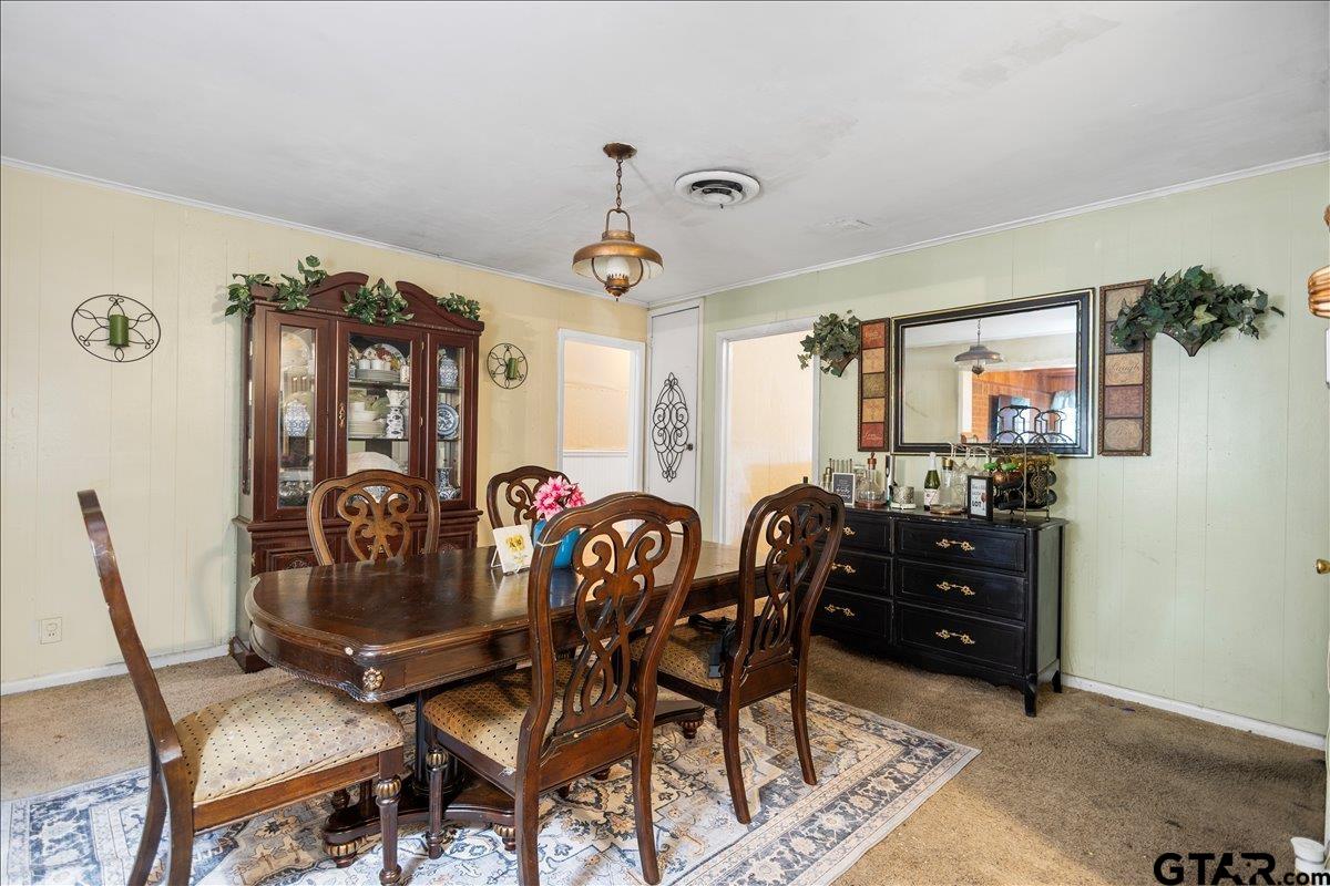 3211 Shady Trail Drive Tyler, TX 75702 - Photo 9 of 30 a view of a dining room with furniture and chandelier