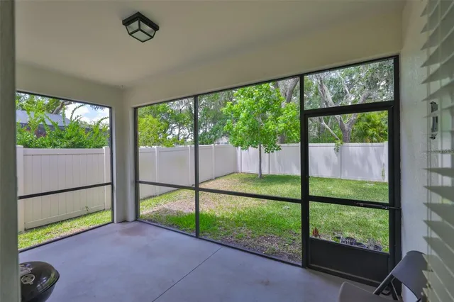 a view of a garden with an outdoor seating space