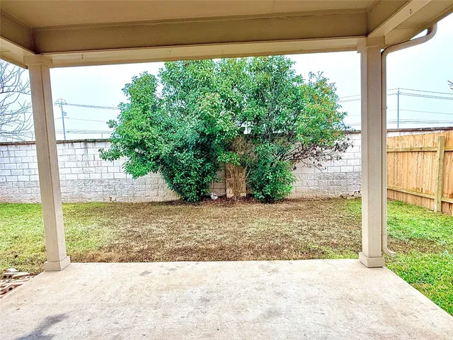 a view of a backyard of a house with a outdoor space