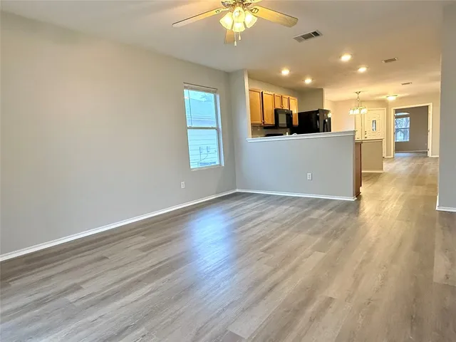 a view of kitchen with wooden floor and windows