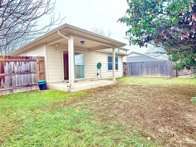 a front view of a house with a yard and porch