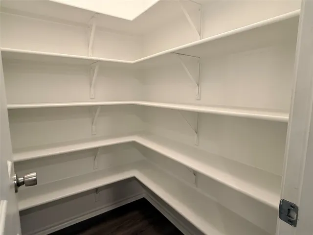 a view of an empty walk in closet